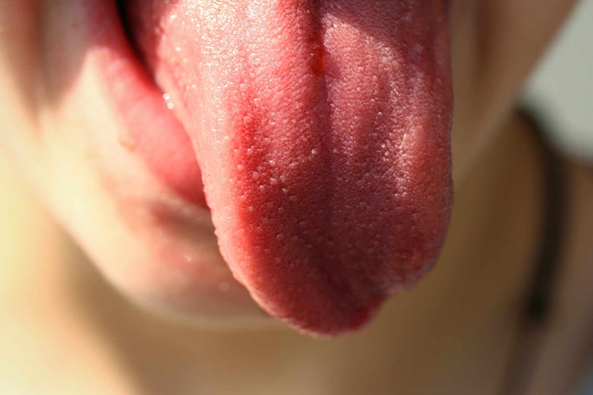 Close up of a human tongue.